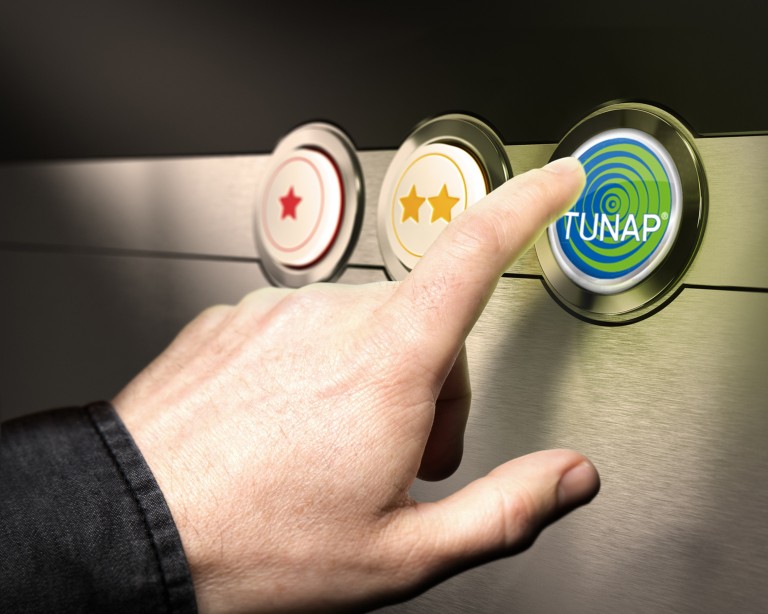 TUNAP Çözümleri TUNAP yazan bir düğmeyi işaret eden el